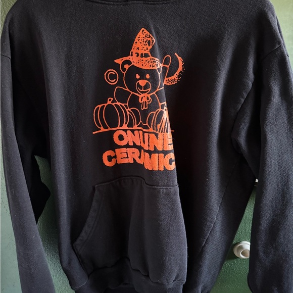 Black Sweater with Orange Graphic